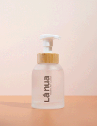 handing pumping a sex toy cleaner foaming bottle with bamboo and glass bottle