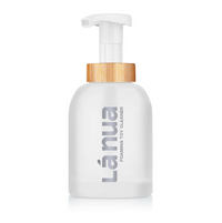 White sex toy cleaner bottle with pump and wooden cap labeled 'Lánua' on a white background